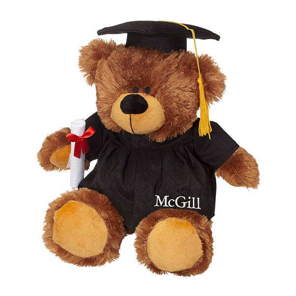 20" jumbo Grad Bear carrying a detachable diploma and dressed in a cap and gown featuring a golden tassel and “McGill” imprinted on the robe.