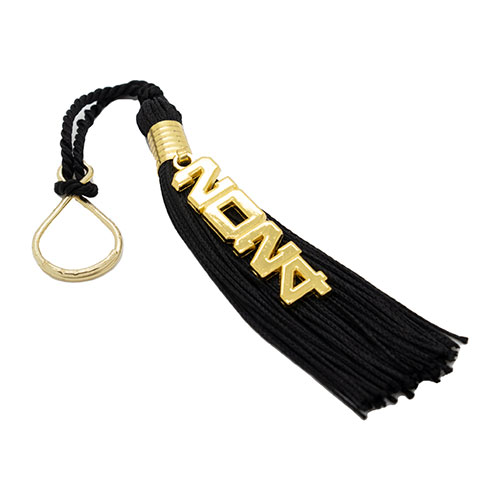 A plush black tassel, with a cutout 14k gold plated "2024" charm and keyring