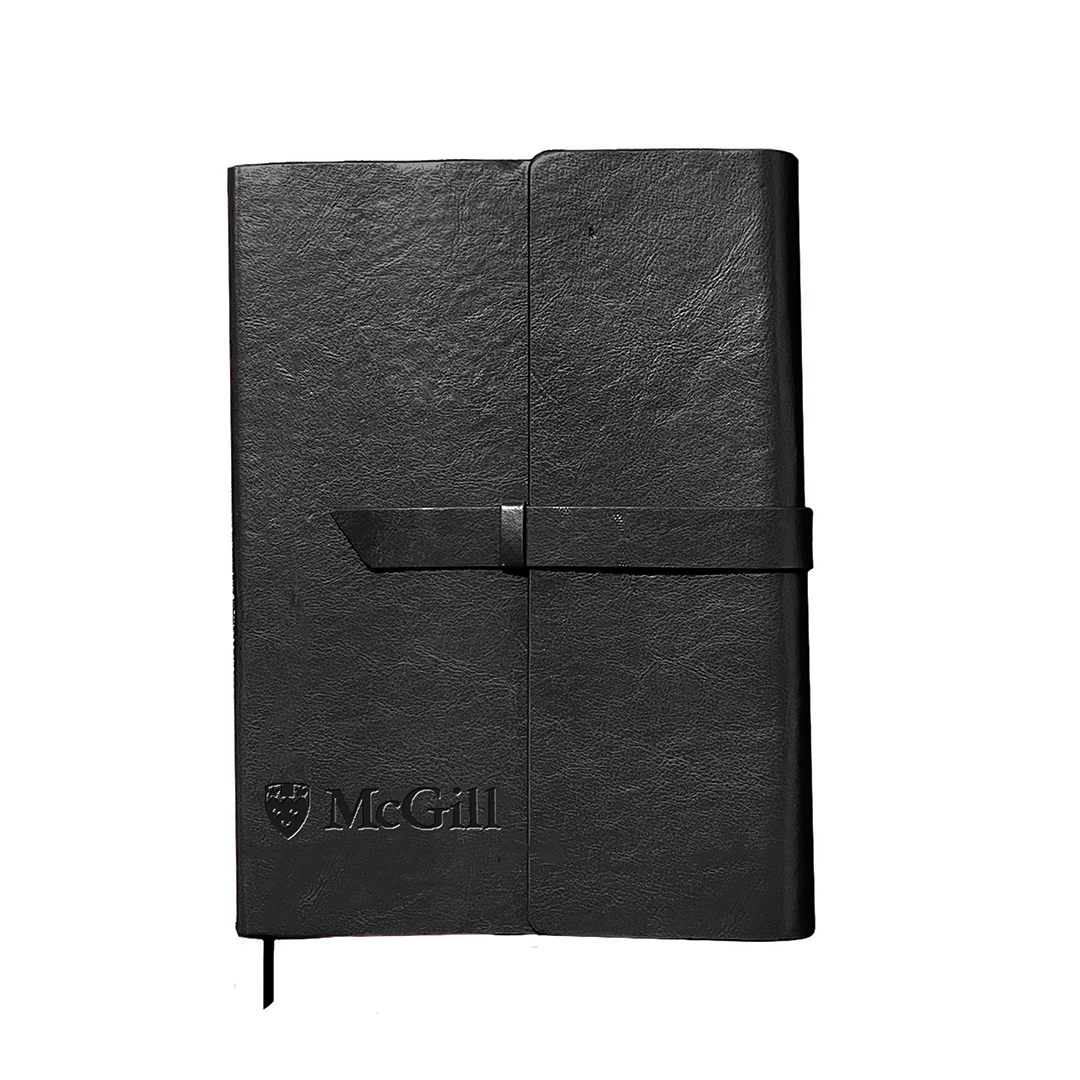 Leather-like notebook with a laser-etched McGill logo and exterior strap and loop closure